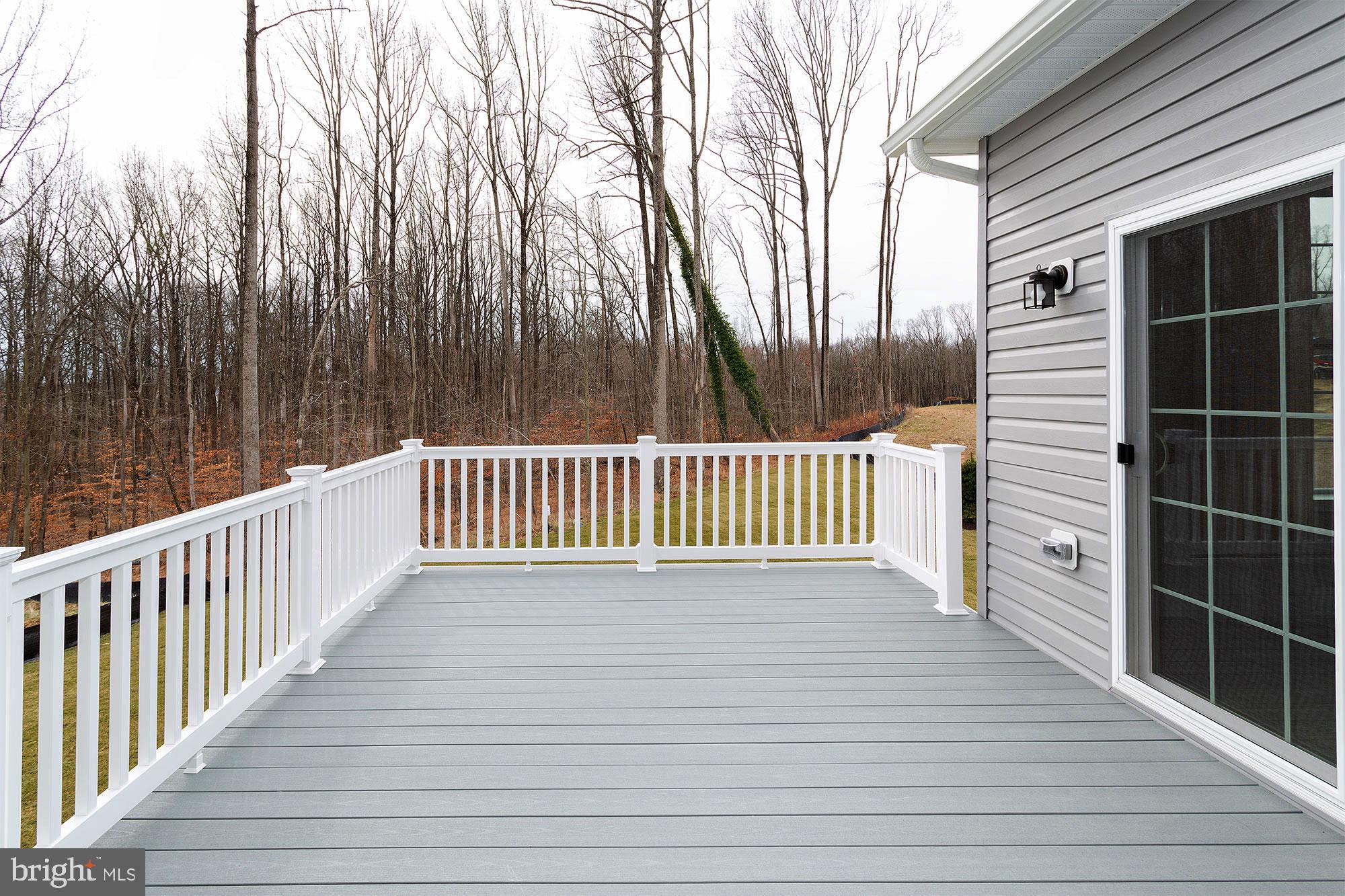 15719 Henrietta Drive Accokeek, MD 20607 - Photo 11 of 20 Spacious deck with serene woodland views.