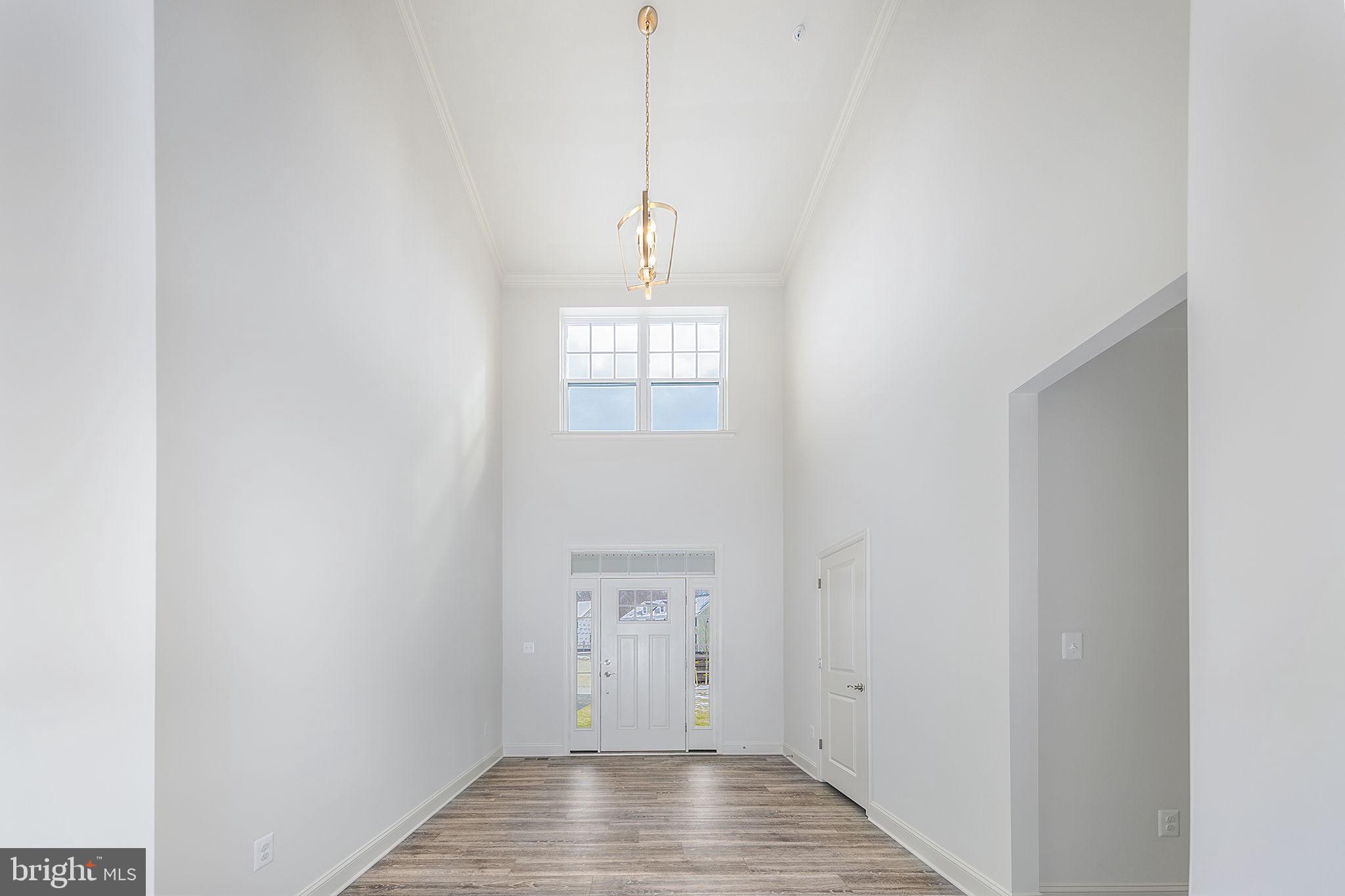 15719 Henrietta Drive Accokeek, MD 20607 - Photo 11 of 48 a view of a hallway with wooden floor and a window