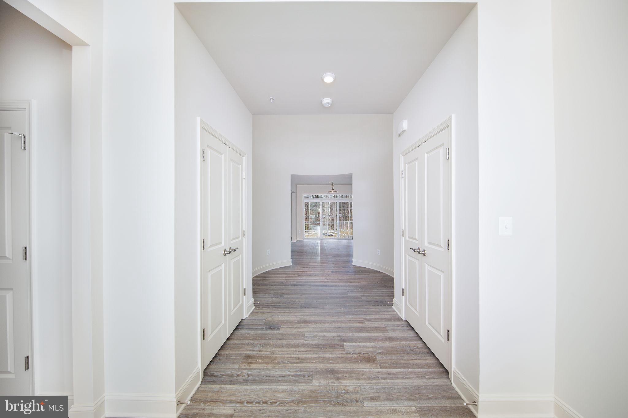 15719 Henrietta Drive Accokeek, MD 20607 - Photo 14 of 48 a view of a hallway with wooden floor