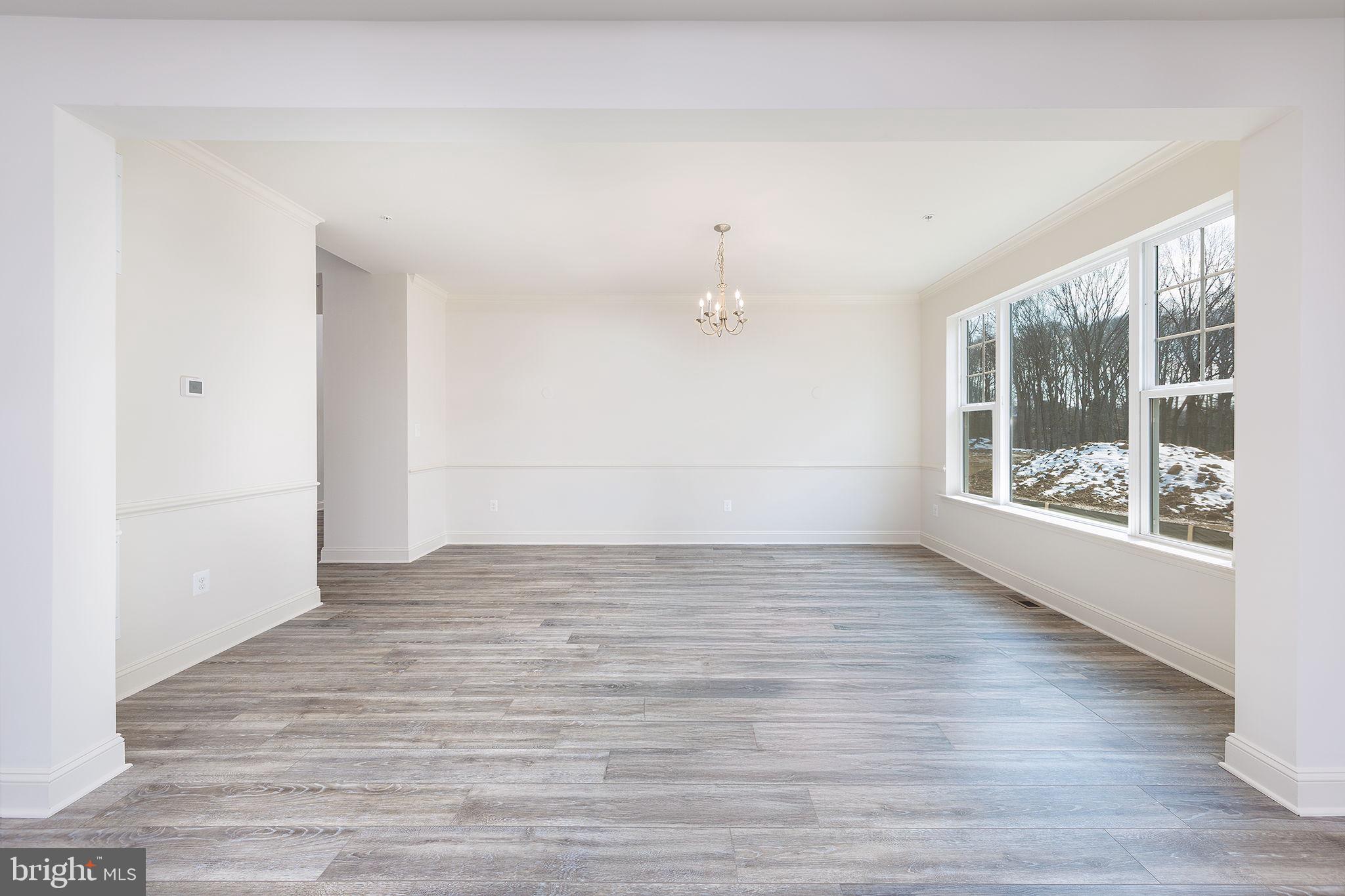 15719 Henrietta Drive Accokeek, MD 20607 - Photo 19 of 48 a view of an empty room with wooden floor and a window