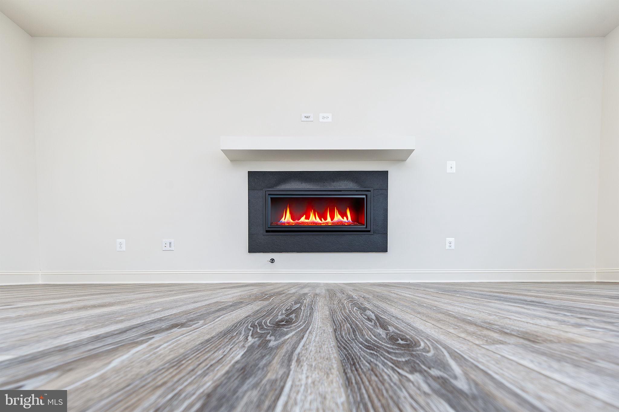 15719 Henrietta Drive Accokeek, MD 20607 - Photo 21 of 48 a view of a room with wooden floor and a fireplace