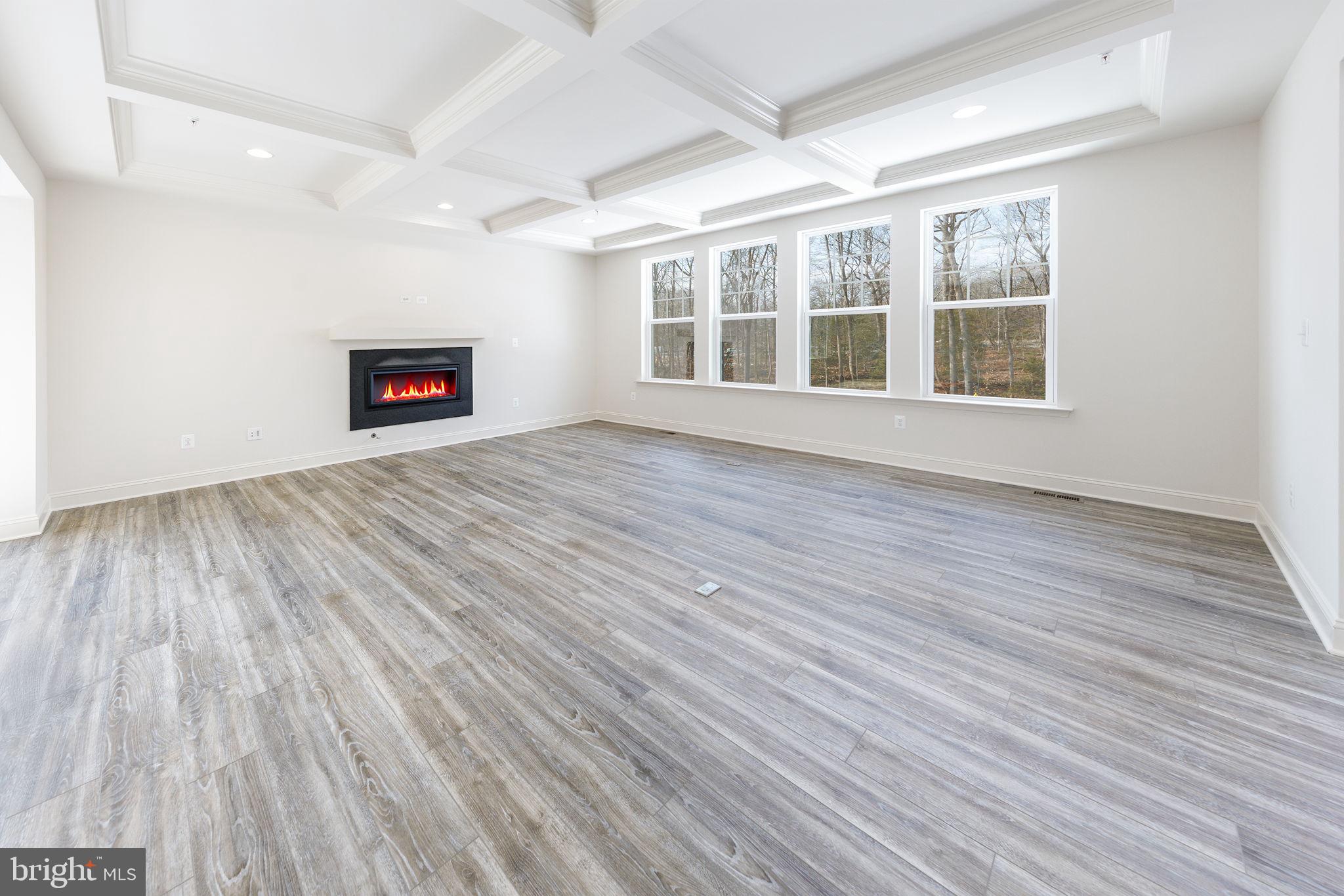 15719 Henrietta Drive Accokeek, MD 20607 - Photo 23 of 48 a view of an empty room with wooden floor and a window