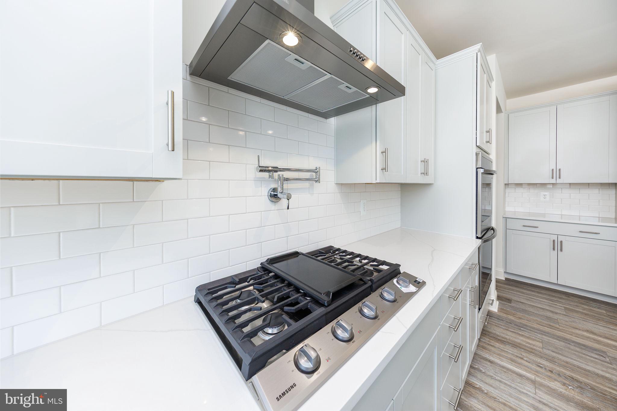 15719 Henrietta Drive Accokeek, MD 20607 - Photo 26 of 48 a stove top oven sitting inside of a kitchen