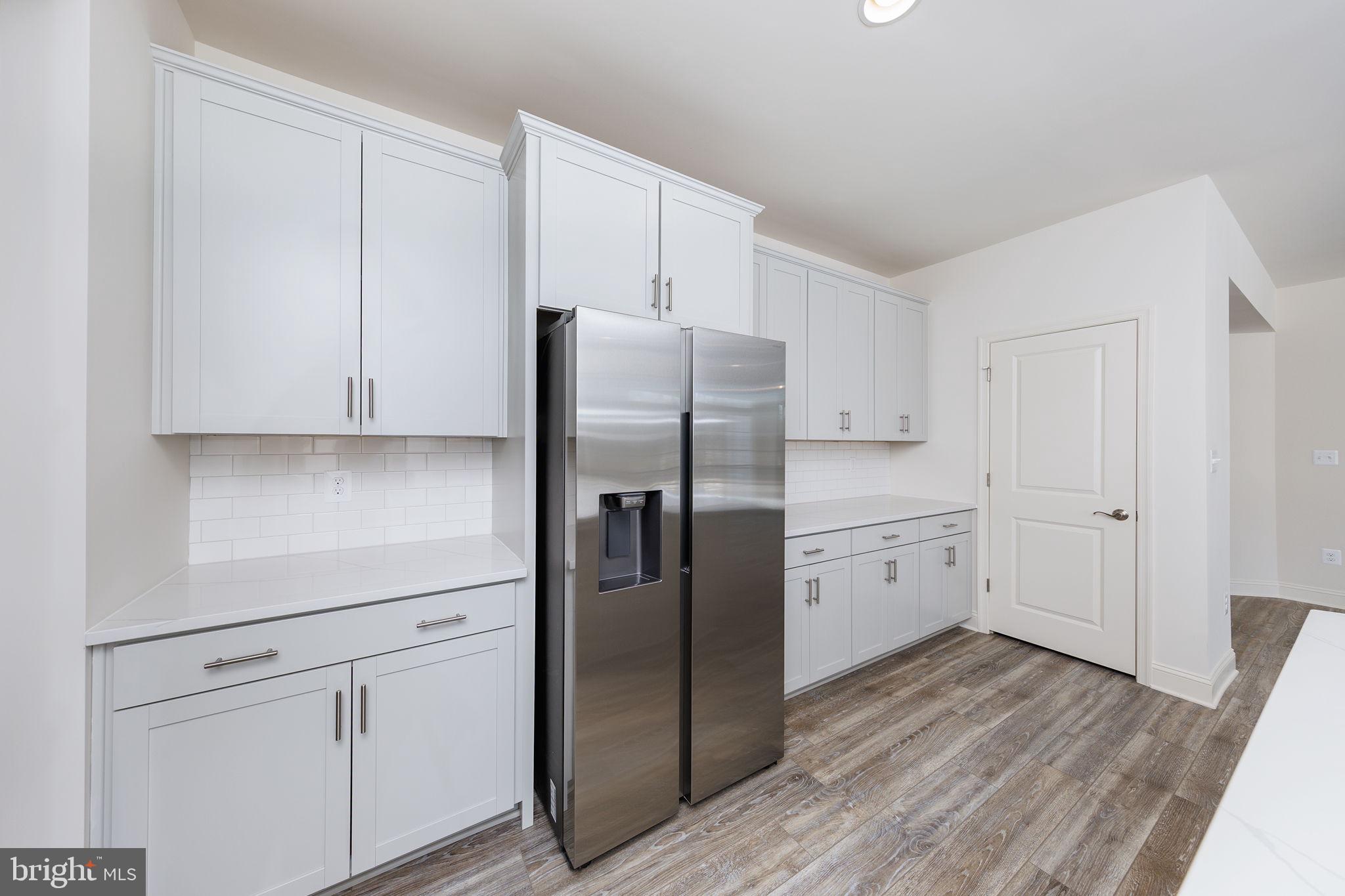 15719 Henrietta Drive Accokeek, MD 20607 - Photo 30 of 48 a kitchen with stainless steel appliances a refrigerator and cabinets