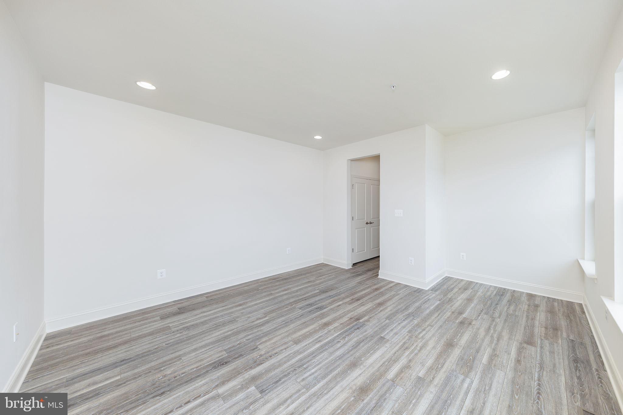 15719 Henrietta Drive Accokeek, MD 20607 - Photo 35 of 48 a view of an empty room with wooden floor and closet