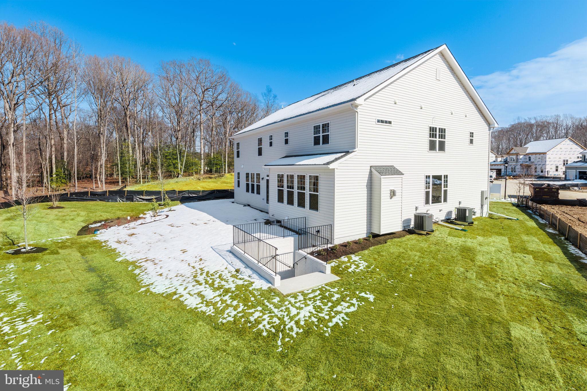15719 Henrietta Drive Accokeek, MD 20607 - Photo 5 of 48 a view of a white house with a yard