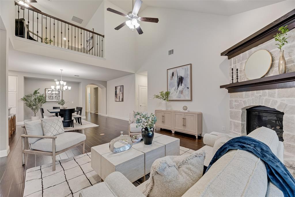 1508 Cherry Blossom Lane Prosper, TX 75078 - Photo 1 of 40 a living room with furniture and a fireplace
