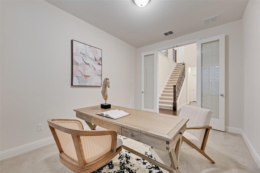 1508 Cherry Blossom Lane Prosper, TX 75078 - Photo 14 of 40 a room that has a table and a chair in it