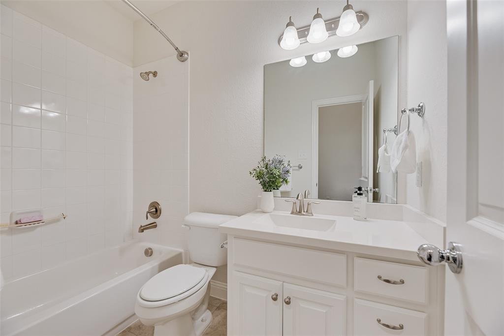 1508 Cherry Blossom Lane Prosper, TX 75078 - Photo 16 of 40 a bathroom with a sink vanity tub and toilet
