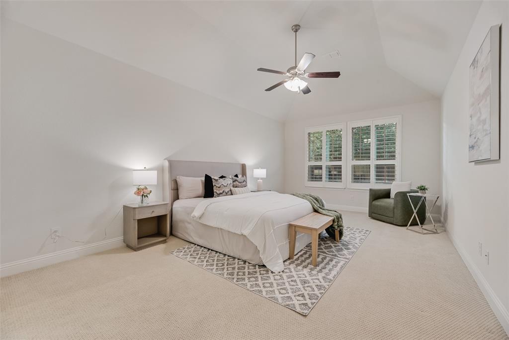 1508 Cherry Blossom Lane Prosper, TX 75078 - Photo 17 of 40 a bedroom with a bed and a window