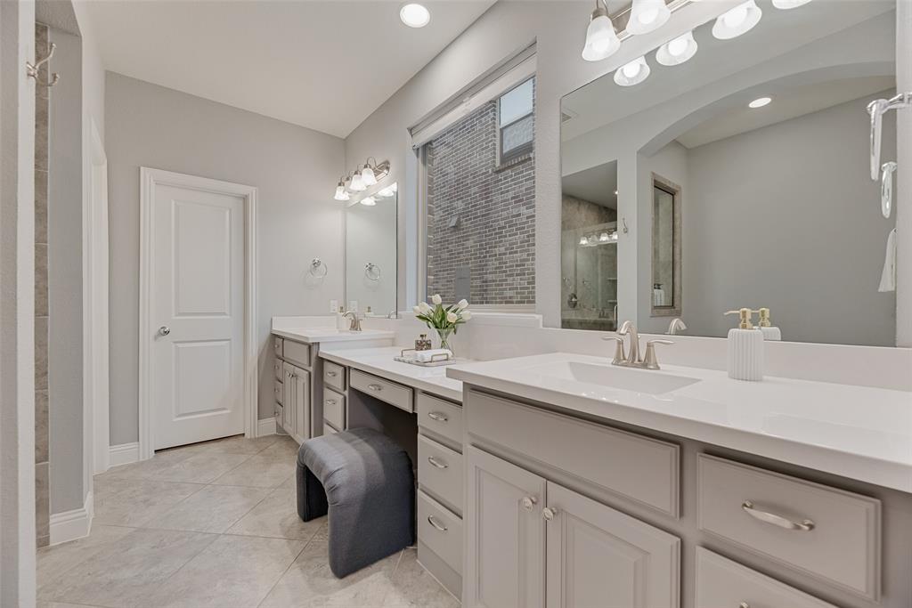 1508 Cherry Blossom Lane Prosper, TX 75078 - Photo 19 of 40 a spacious bathroom with a sink and a mirror