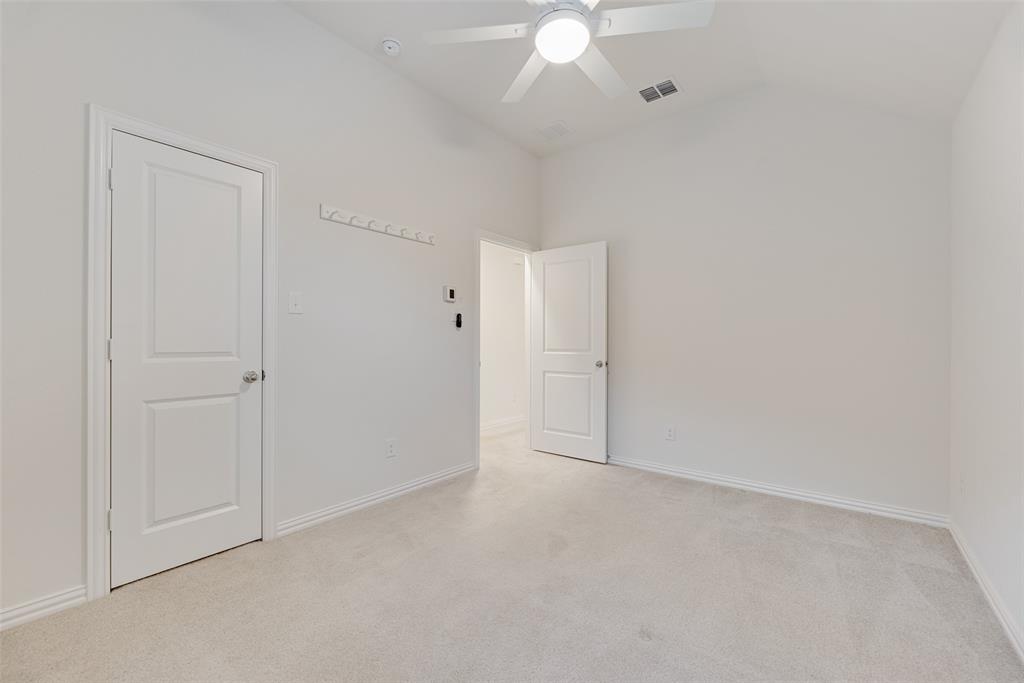 1508 Cherry Blossom Lane Prosper, TX 75078 - Photo 24 of 40 a view of an empty room