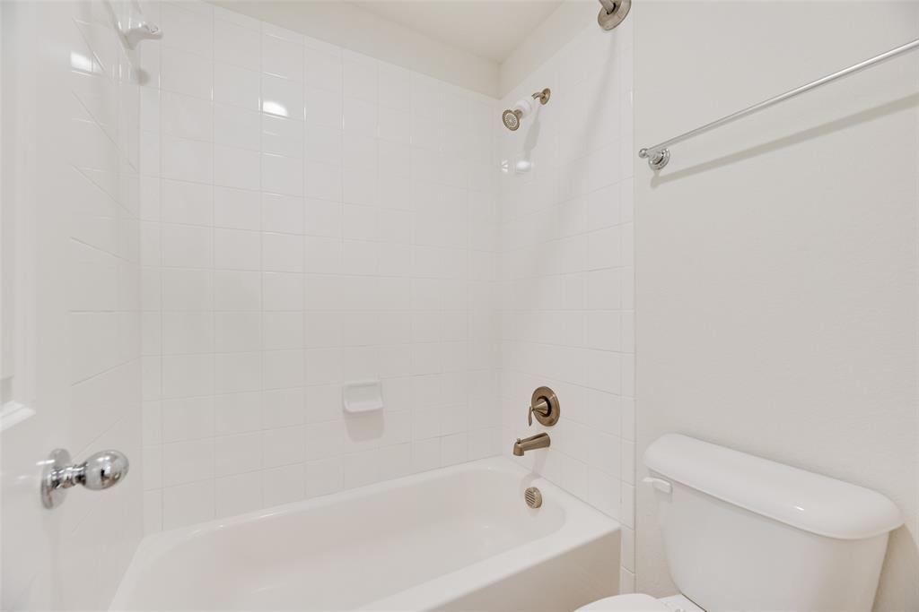 1508 Cherry Blossom Lane Prosper, TX 75078 - Photo 27 of 40 a bathroom with a bathtub and toilet