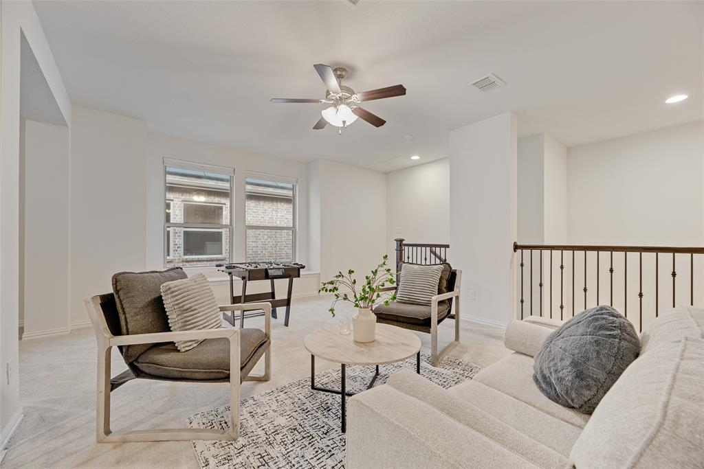 1508 Cherry Blossom Lane Prosper, TX 75078 - Photo 32 of 40 a living room with furniture and wooden floor
