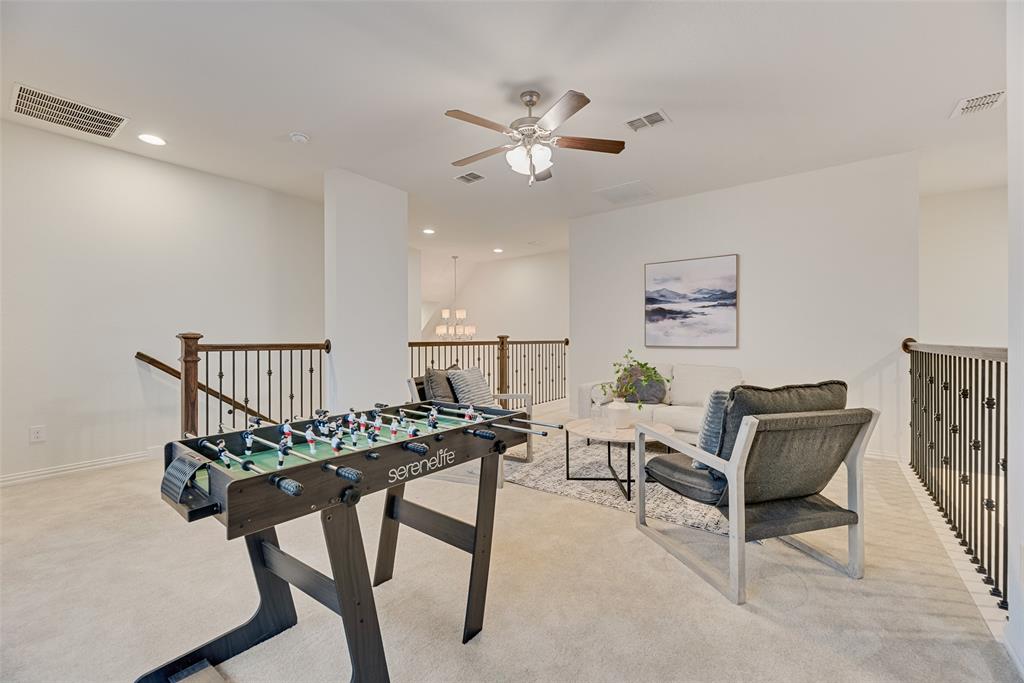 1508 Cherry Blossom Lane Prosper, TX 75078 - Photo 33 of 40 a view of a workspace with furniture and a chandelier fan