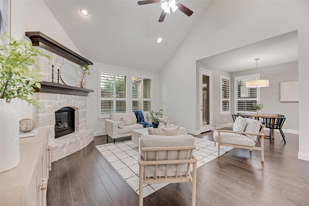1508 Cherry Blossom Lane Prosper, TX 75078 - Photo 7 of 40 a living room with fireplace furniture and a large window