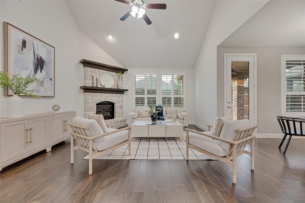 1508 Cherry Blossom Lane Prosper, TX 75078 - Photo 8 of 40 a living room with furniture and a fireplace