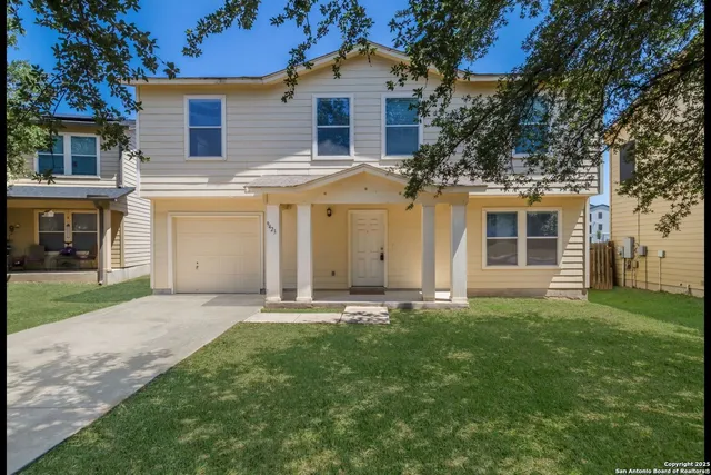front view of a house with a yard