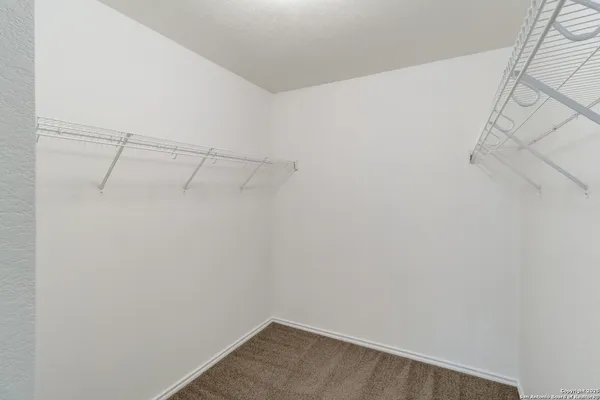 a view of a room with racks on the wall