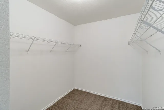 a view of a room with racks on the wall