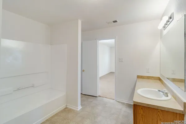 a bathroom with a sink and a bathtub