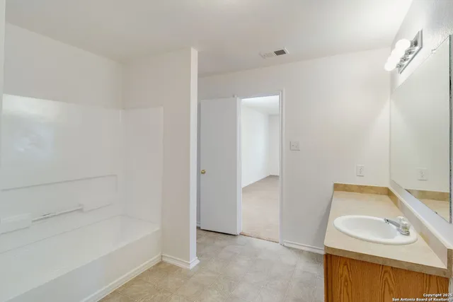a bathroom with a sink and a bathtub