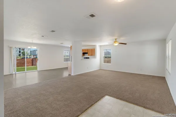 an empty room with a empty space and window