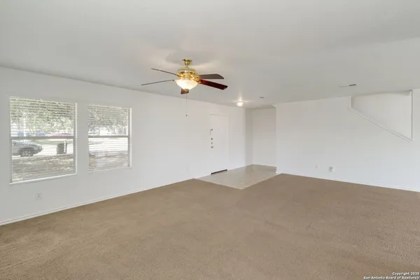 a view of an empty room with a window