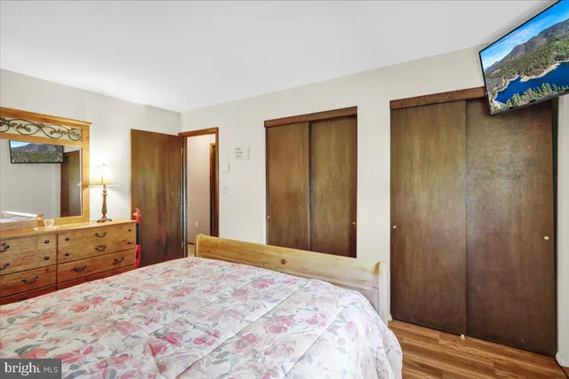 a bedroom with a bed and a dresser