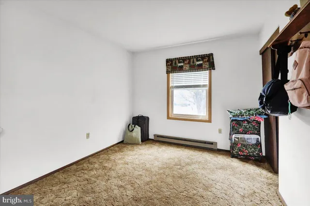 a view of room with window and workspace