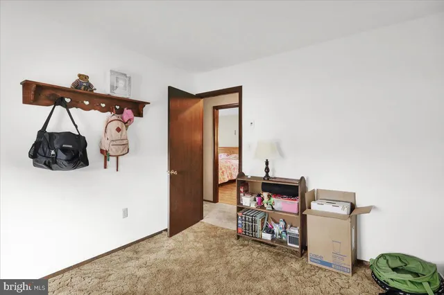 a bedroom with a bed and cabinets