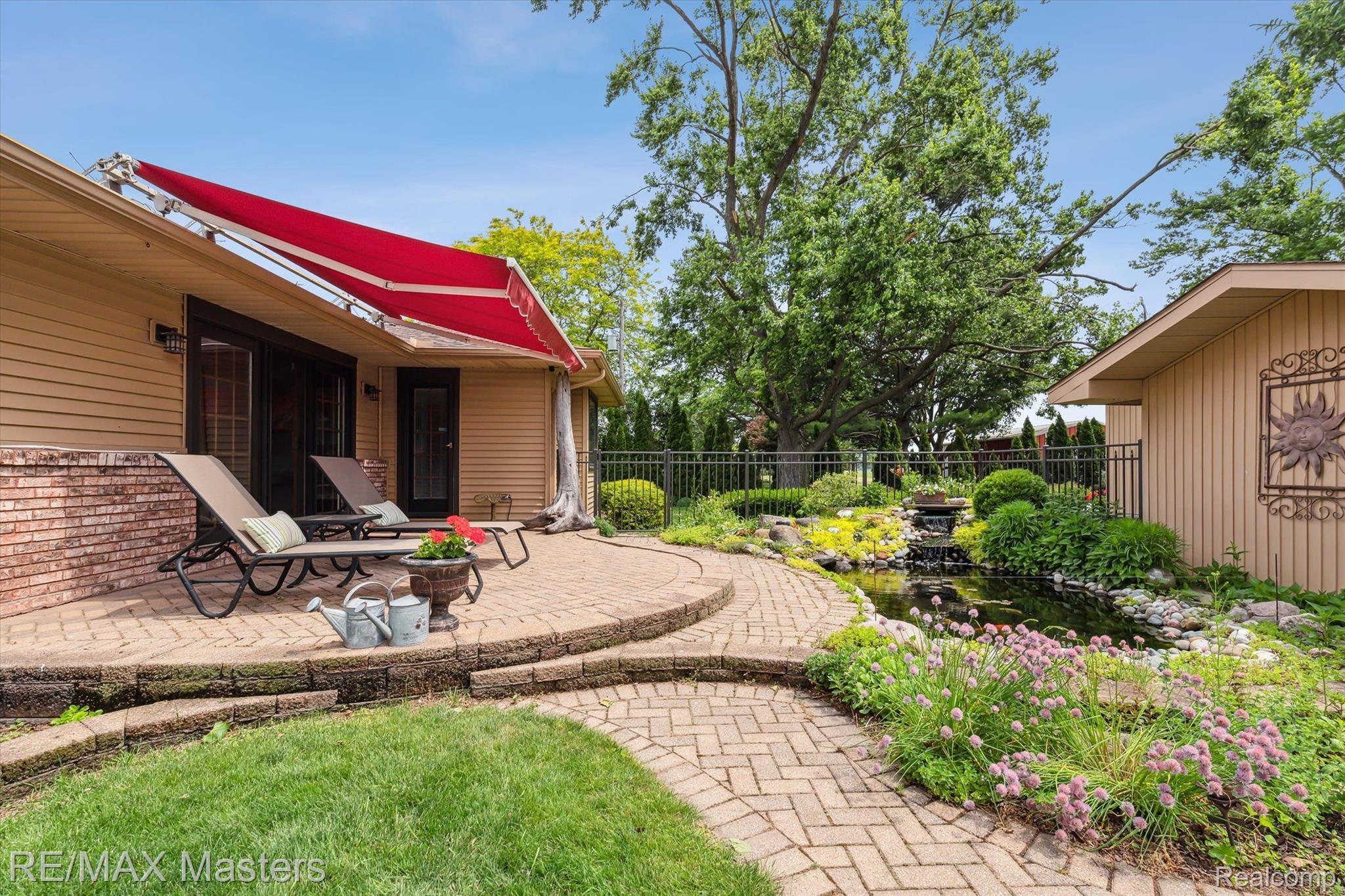 2273 Strasburg Road Monroe, MI 48161 - Photo 38 of 59 Paver Patio w Retractable Awning Overlooking Pond