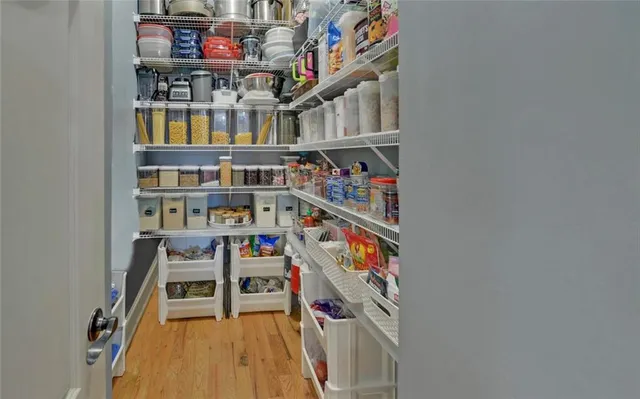 a view of a dining room with furniture windows and wooden floor
