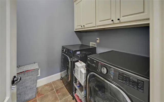 a bathroom with a granite countertop sink mirror and shower