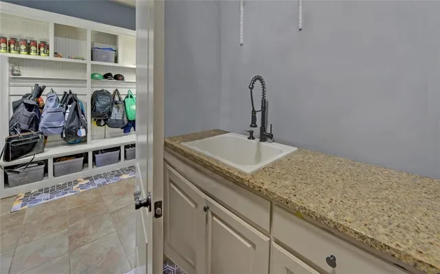 a bathroom with a tub a sink and a shower