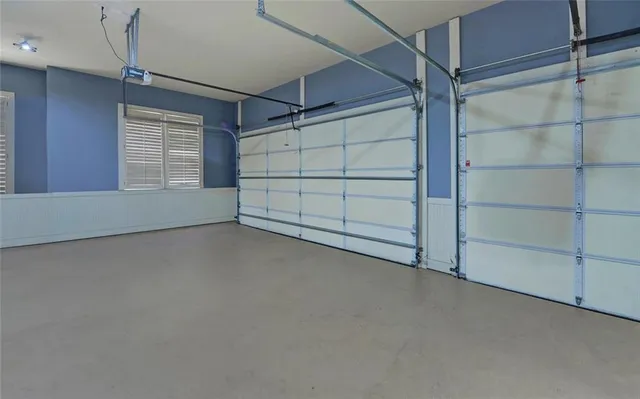 a spacious bathroom with a granite countertop sink mirror and bathtub