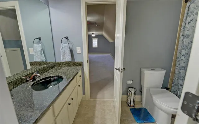 a kitchen with a stove a sink a table and chairs