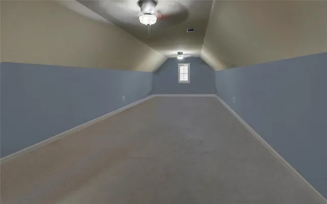 a view of washer and dryer with kitchen in the background