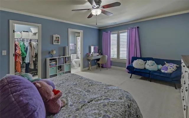 a bedroom with a bed chair and a window