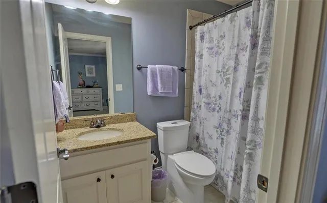 a bathroom with a sink a mirror and shower