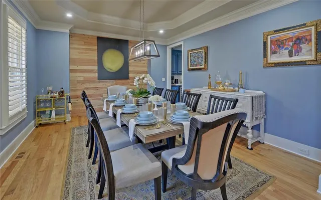 a view of a dining room with furniture and window