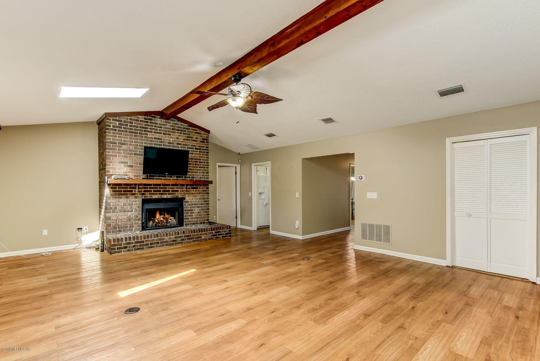 11060 Reading Road Jacksonville, FL 32257 - Photo 12 of 43 a view of empty room with wooden floor and fireplace