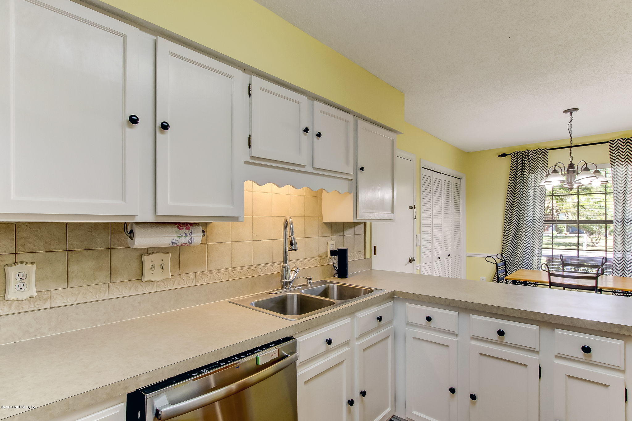 11060 Reading Road Jacksonville, FL 32257 - Photo 15 of 43 a kitchen with granite countertop white cabinets white appliances and sink