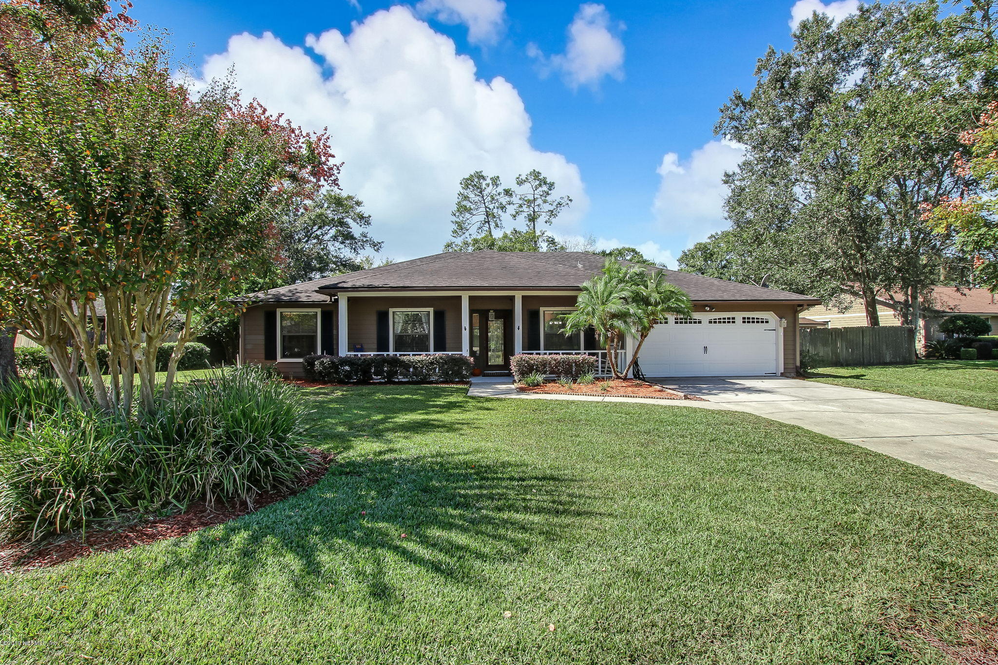 11060 Reading Road Jacksonville, FL 32257 - Photo 2 of 43 a front view of a house with a garden