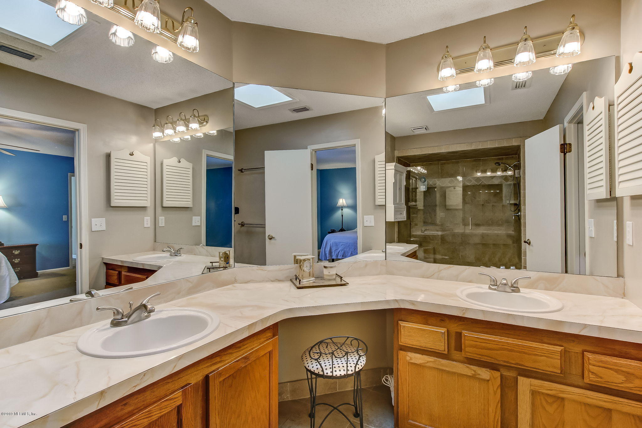 11060 Reading Road Jacksonville, FL 32257 - Photo 26 of 43 a bathroom with a sink double vanity and a mirror