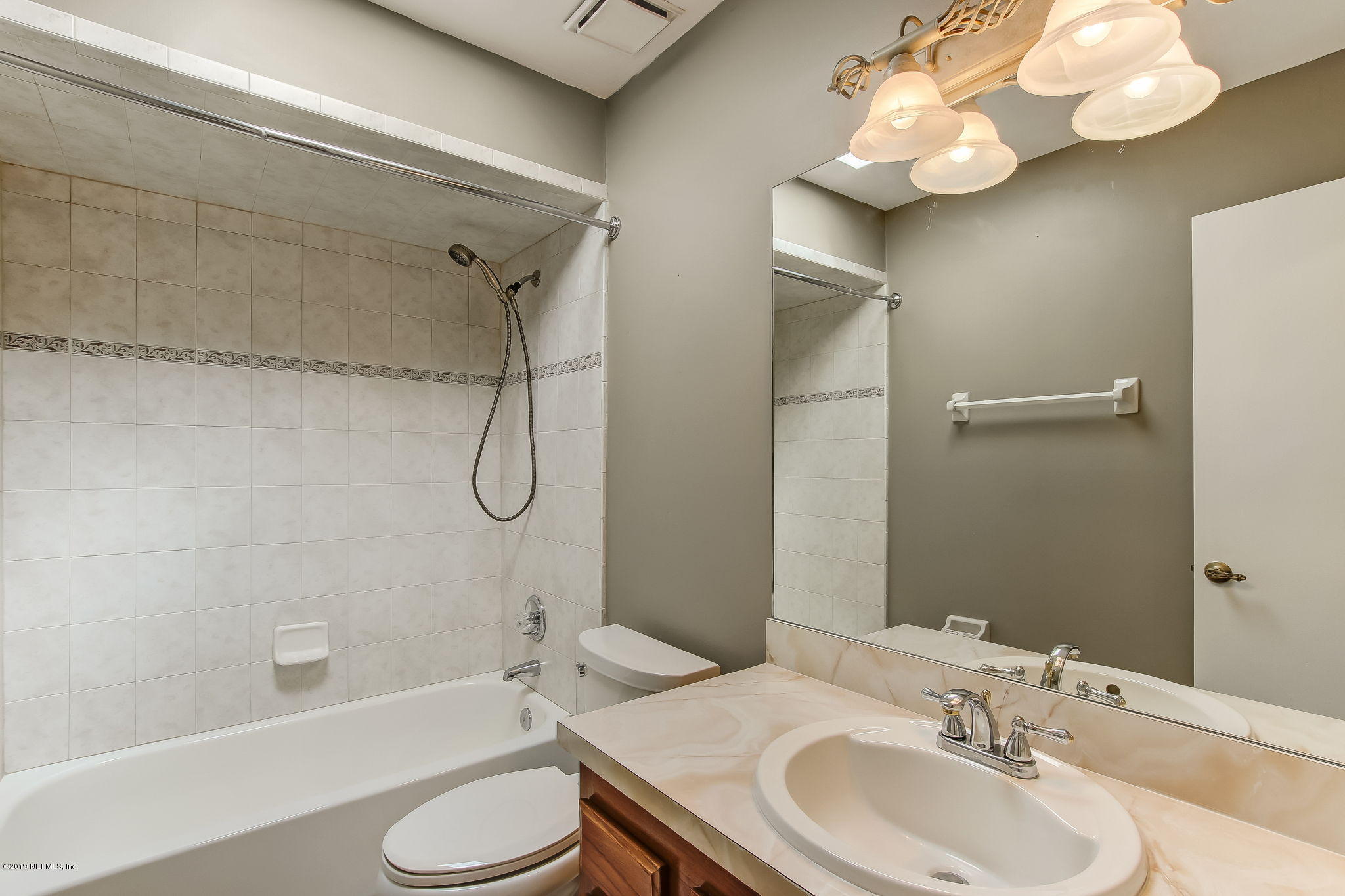 11060 Reading Road Jacksonville, FL 32257 - Photo 28 of 43 a bathroom with a sink a toilet and shower