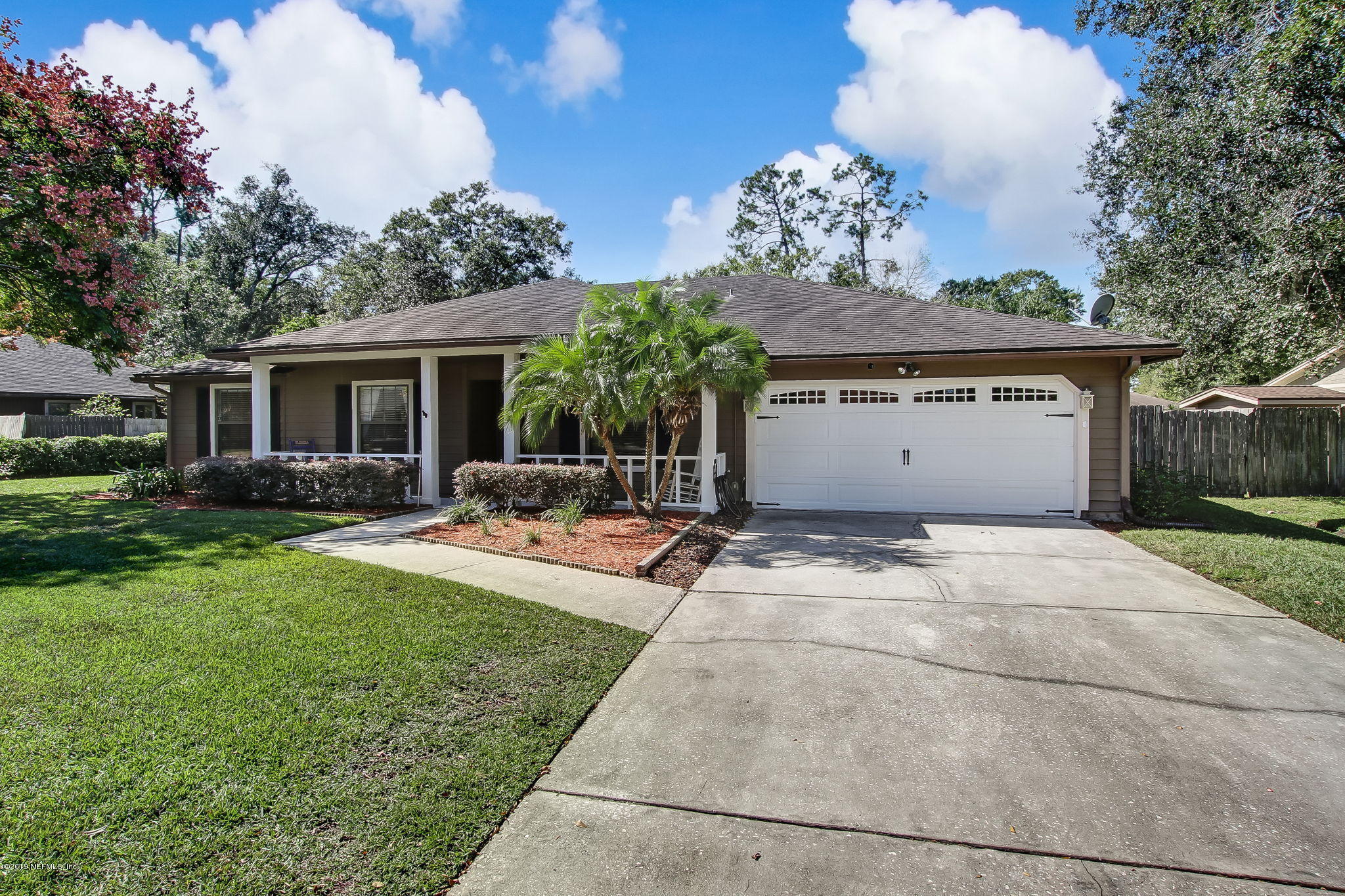 11060 Reading Road Jacksonville, FL 32257 - Photo 3 of 43 a front view of house with yard and trees around