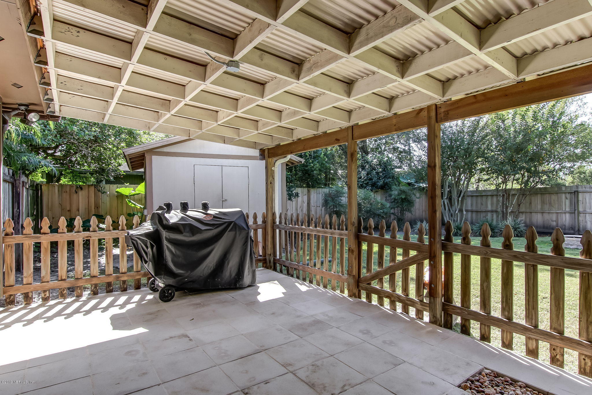 11060 Reading Road Jacksonville, FL 32257 - Photo 33 of 43 a view of a patio with table and chairs with wooden floor