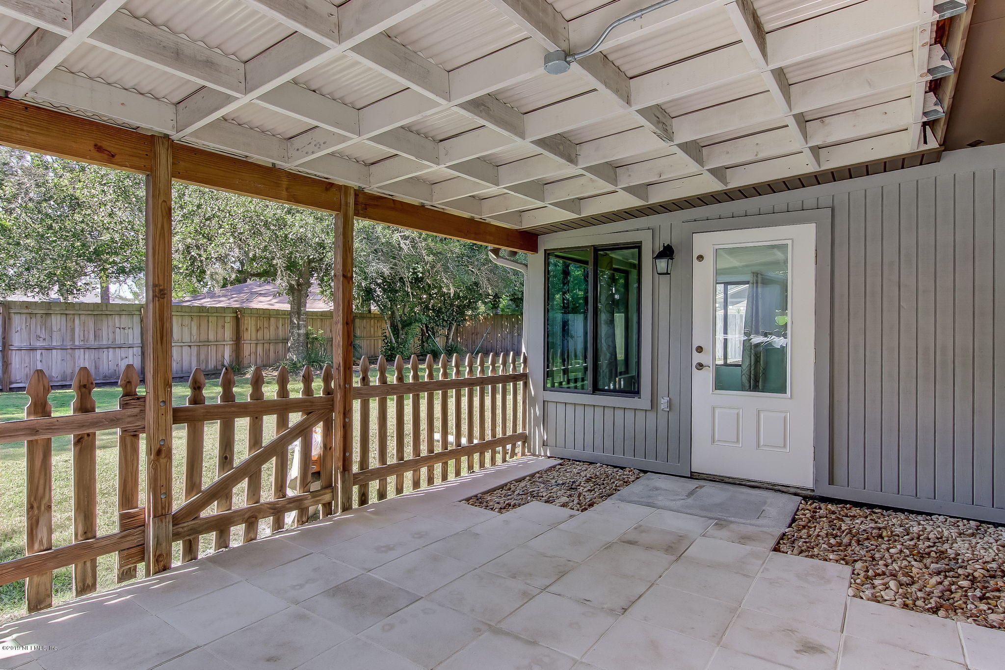 11060 Reading Road Jacksonville, FL 32257 - Photo 35 of 43 a view of a porch with wooden floor and fence