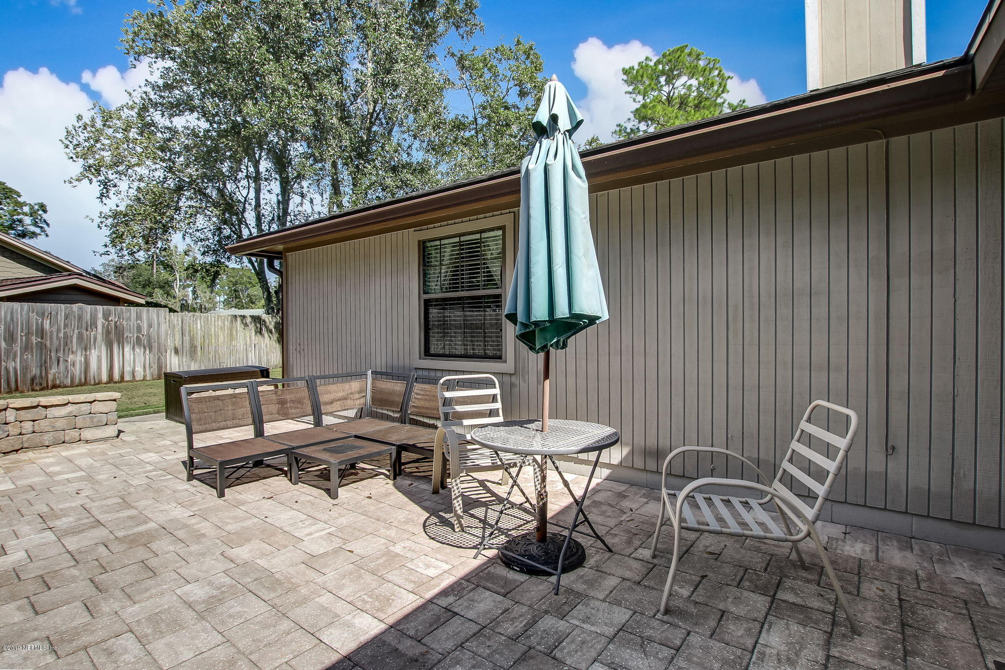 11060 Reading Road Jacksonville, FL 32257 - Photo 37 of 43 a backyard of a house with table and chairs